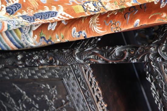 A Chinese black lacquered rosewood cabinet, late 19th century, W.3ft 9in. H.7ft D.1ft 5in.
